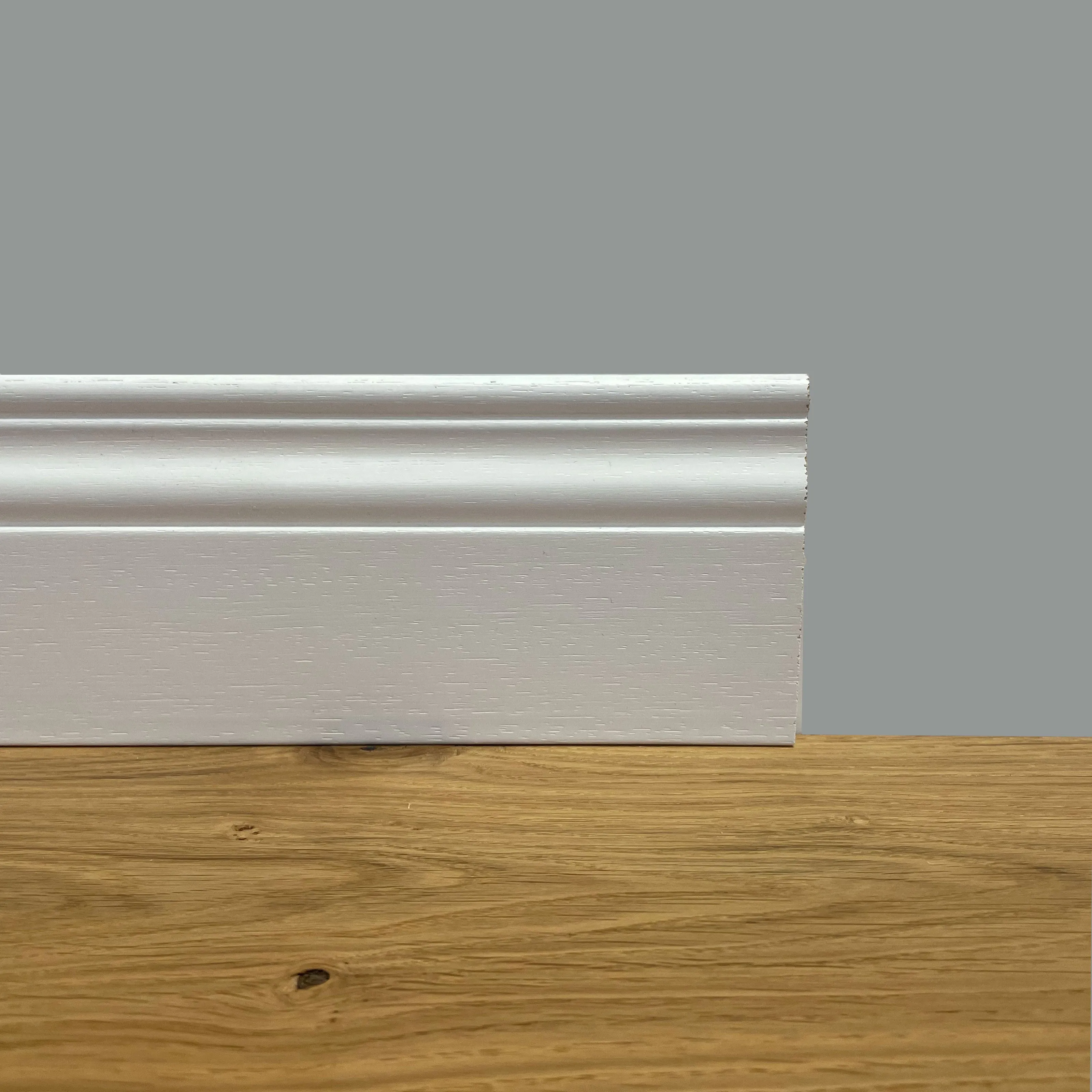 BATTISCOPA SLIM laccato bianco in legno MASSELLO DUCALE 100X10 (prezzo al ML)